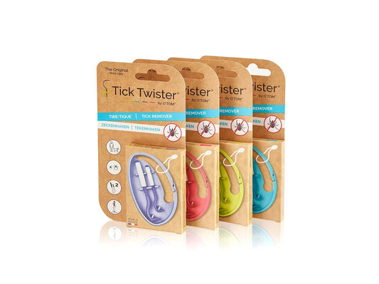 Vier OTOM TICK TWISTER O'TOM Zeckenhaken Clip-Box-Sets (je 2 Stück) in lila, grünen, rosa und blauen Etuis sind in einer Reihe vor weißem Hintergrund angeordnet.